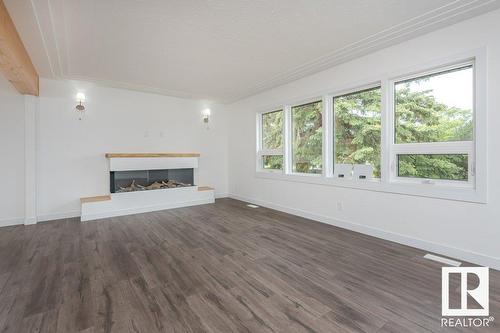 8803 145 St Nw, Edmonton, AB - Indoor Photo Showing Living Room With Fireplace