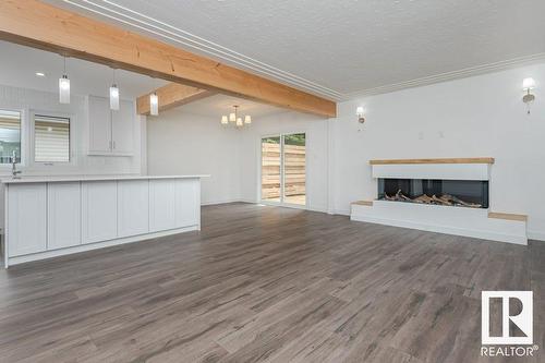 8803 145 St Nw, Edmonton, AB - Indoor Photo Showing Living Room With Fireplace