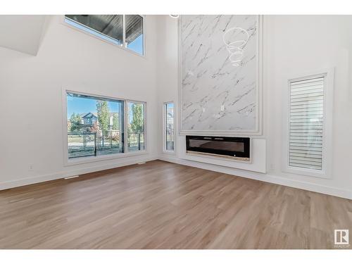 8377 Mayday Link Li Sw, Edmonton, AB - Indoor Photo Showing Living Room With Fireplace