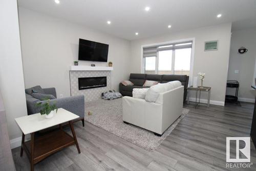 17939 59 St Nw Nw, Edmonton, AB - Indoor Photo Showing Living Room With Fireplace