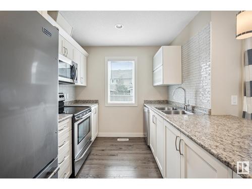 #55 1391 Starling Dr Nw, Edmonton, AB - Indoor Photo Showing Kitchen With Double Sink