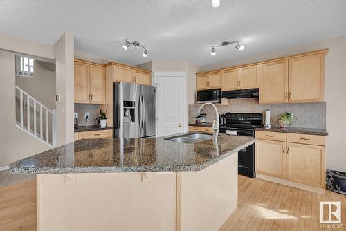 7719 7A Av Sw, Edmonton, AB - Indoor Photo Showing Kitchen With Double Sink