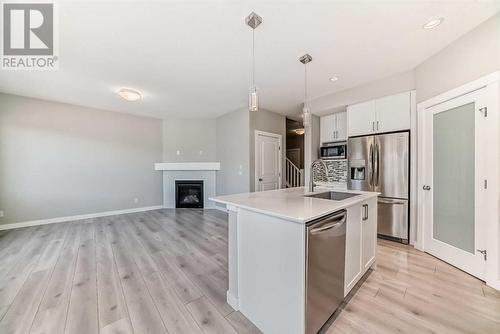 48 Nolanhurst Crescent Nw, Calgary, AB - Indoor Photo Showing Kitchen With Fireplace With Upgraded Kitchen