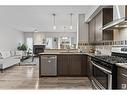 3017 Checknita Wy Sw, Edmonton, AB  - Indoor Photo Showing Kitchen With Fireplace With Upgraded Kitchen 