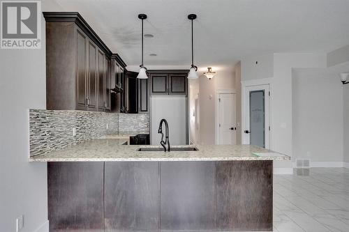 244 Shalestone Way Nw, Fort Mcmurray, AB - Indoor Photo Showing Kitchen With Upgraded Kitchen