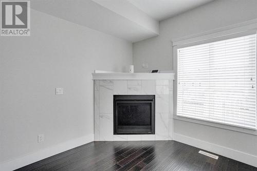 244 Shalestone Way Nw, Fort Mcmurray, AB - Indoor Photo Showing Living Room With Fireplace