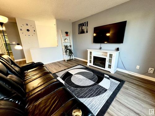 4609 35 Av Nw, Edmonton, AB - Indoor Photo Showing Living Room With Fireplace