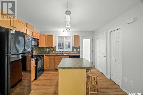 49 2751 Windsor Park Road, Regina, SK - Indoor Photo Showing Kitchen With Double Sink