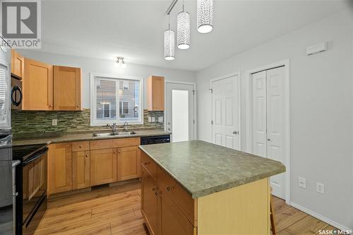 49 2751 Windsor Park Road, Regina, SK - Indoor Photo Showing Kitchen With Double Sink