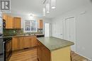 49 2751 Windsor Park Road, Regina, SK  - Indoor Photo Showing Kitchen With Double Sink 