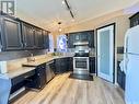 911 Bercovich Crescent, Regina, SK  - Indoor Photo Showing Kitchen With Double Sink With Upgraded Kitchen 