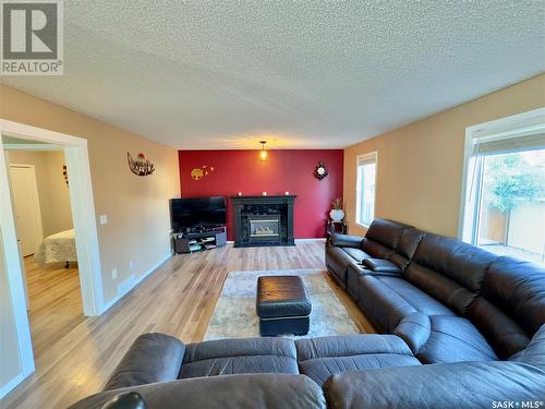 911 Bercovich Crescent, Regina, SK - Indoor Photo Showing Living Room With Fireplace