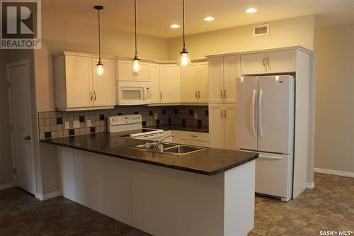 106 Erickson Street, Midale, SK - Indoor Photo Showing Kitchen With Double Sink