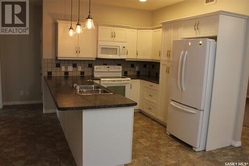 106 Erickson Street, Midale, SK - Indoor Photo Showing Kitchen With Double Sink