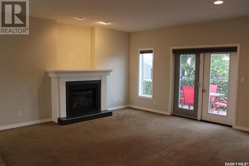 106 Erickson Street, Midale, SK - Indoor Photo Showing Living Room With Fireplace