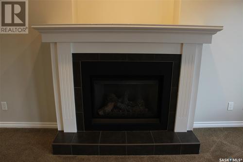 106 Erickson Street, Midale, SK - Indoor Photo Showing Living Room With Fireplace