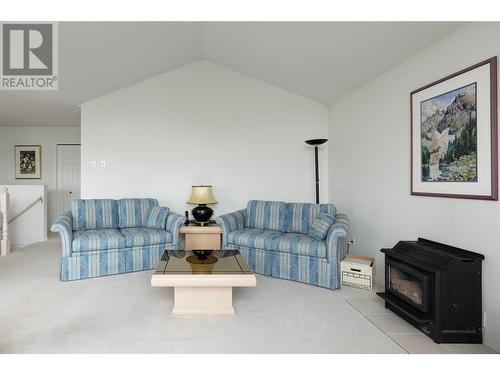 9110 Smith Road, Vernon, BC - Indoor Photo Showing Living Room With Fireplace