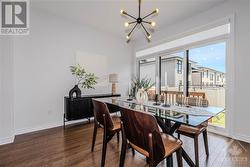 Bright Dining Room off kitchen with 3 panel sliding door to backyard - 