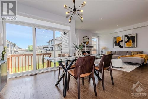 3 panel sliding door and 2 Great Room Windows brings in tons of sunlights - 600 Triangle Street, Ottawa, ON - Indoor Photo Showing Dining Room