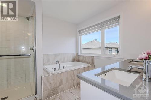 5 pc ensuite with oversized standalone shower, bath tub, and double vanities - 600 Triangle Street, Ottawa, ON - Indoor Photo Showing Bathroom