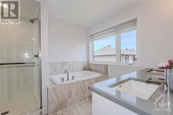 5 pc ensuite with oversized standalone shower, bath tub, and double vanities - 