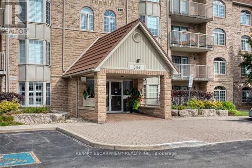 104 E - 216 Plains Road W, Burlington, ON - Outdoor With Balcony With Facade