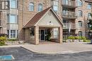 104 E - 216 Plains Road W, Burlington, ON  - Outdoor With Balcony With Facade 