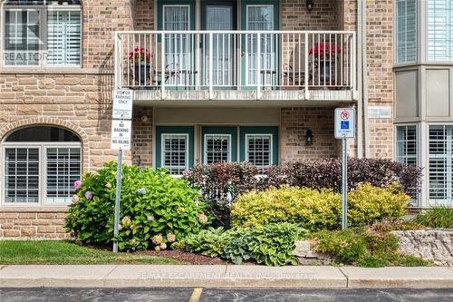 104 E - 216 Plains Road W, Burlington, ON - Outdoor With Balcony With Facade