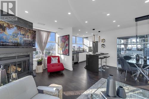 Uph02 - 880 Dundas Street, Mississauga, ON - Indoor Photo Showing Living Room With Fireplace