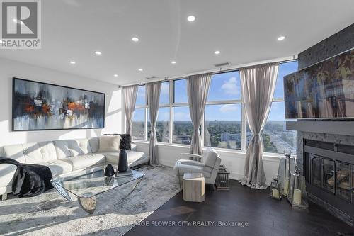 Uph02 - 880 Dundas Street, Mississauga, ON - Indoor Photo Showing Living Room With Fireplace