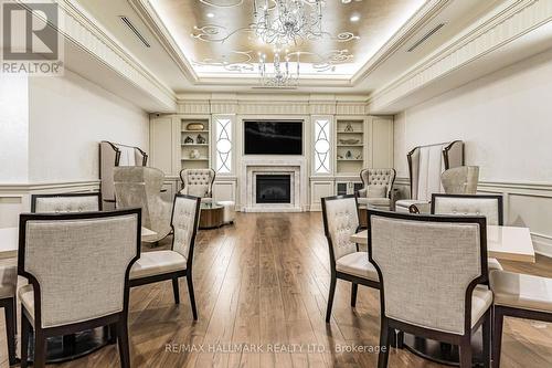 1702 - 9075 Jane Street W, Vaughan, ON - Indoor Photo Showing Dining Room With Fireplace