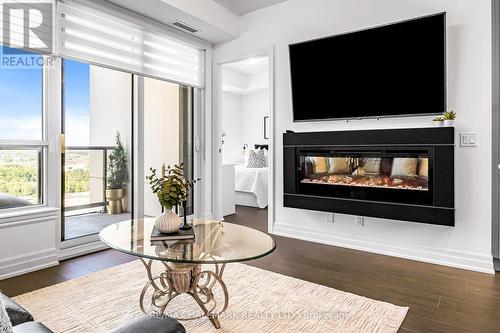 1702 - 9075 Jane Street W, Vaughan, ON - Indoor Photo Showing Living Room With Fireplace