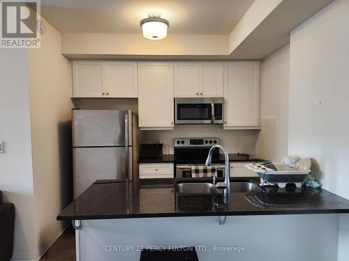 402 - 2 Adam Sellers Street, Markham (Cornell), ON - Indoor Photo Showing Kitchen