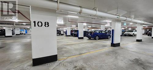 402 - 2 Adam Sellers Street, Markham (Cornell), ON - Indoor Photo Showing Garage