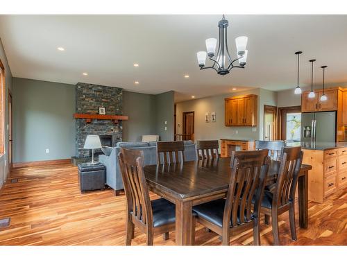 810 White Tail Drive, Rossland, BC - Indoor Photo Showing Dining Room With Fireplace