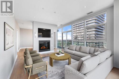 Uph4103 - 33 Shore Breeze Drive, Toronto (Mimico), ON - Indoor Photo Showing Living Room With Fireplace