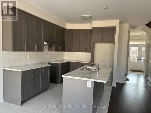 67 Gauley Drive, Centre Wellington, ON - Indoor Photo Showing Kitchen With Double Sink