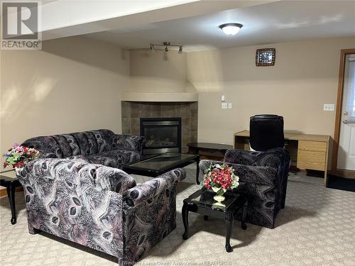 4669 Osaka Circle Unit# Lower Level, Windsor, ON - Indoor Photo Showing Living Room With Fireplace