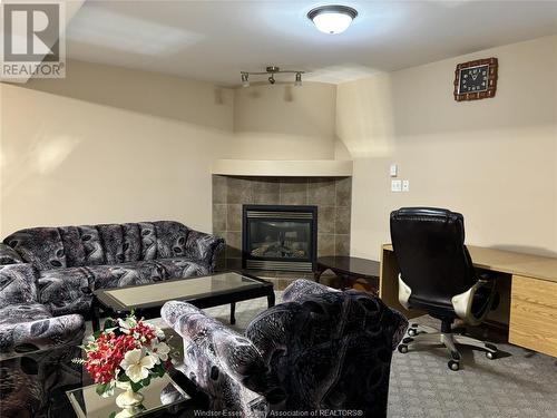 4669 Osaka Circle Unit# Lower Level, Windsor, ON - Indoor Photo Showing Living Room With Fireplace