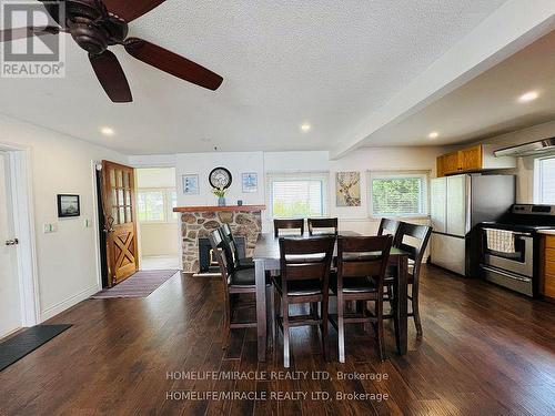 213 Snug Harbour Road, Kawartha Lakes, ON - Indoor Photo Showing Dining Room With Fireplace