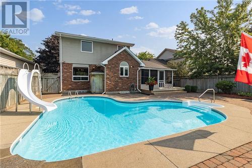 Inground pool and slide - 408 Pearl Street W, Brockville, ON - Outdoor With In Ground Pool With Deck Patio Veranda With Backyard With Exterior