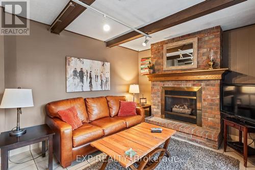 B - 11358 Longwoods Road, Middlesex Centre (Delaware Town), ON - Indoor Photo Showing Living Room With Fireplace