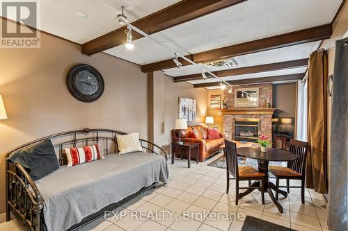 B - 11358 Longwoods Road, Middlesex Centre (Delaware Town), ON - Indoor Photo Showing Bedroom With Fireplace