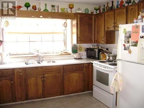 26 Barnes Road, Lumby, BC - Indoor Photo Showing Kitchen With Double Sink