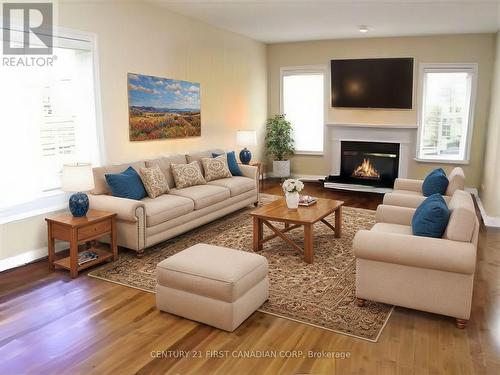 virtually staged - 67 - 505 Blue Jay Drive, London, ON - Indoor Photo Showing Living Room With Fireplace