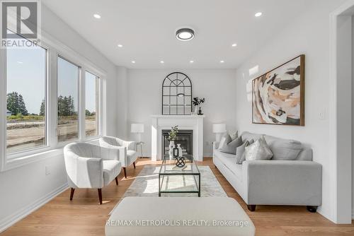 58 Belmont Drive, Clarington, ON - Indoor Photo Showing Living Room With Fireplace