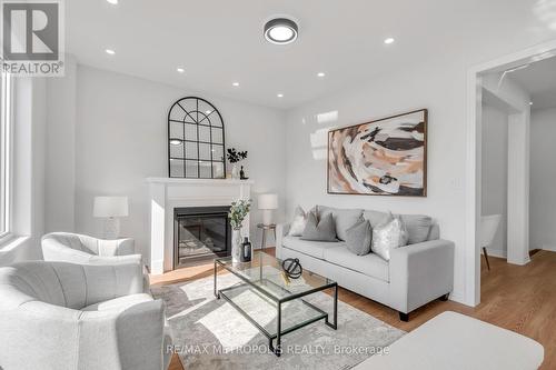 58 Belmont Drive, Clarington (Newcastle), ON - Indoor Photo Showing Living Room With Fireplace