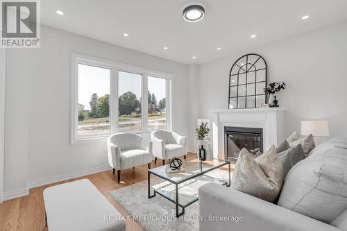 58 Belmont Drive, Clarington, ON - Indoor Photo Showing Living Room With Fireplace