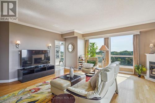 603 - 50 Old Mill Road, Oakville, ON - Indoor Photo Showing Living Room With Fireplace