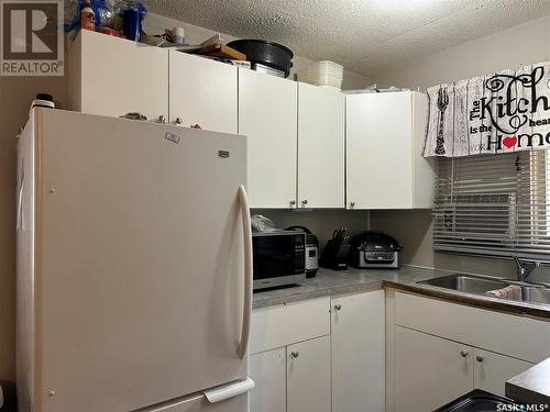 2102-2104 Rothwell Street, Regina, SK - Indoor Photo Showing Kitchen With Double Sink